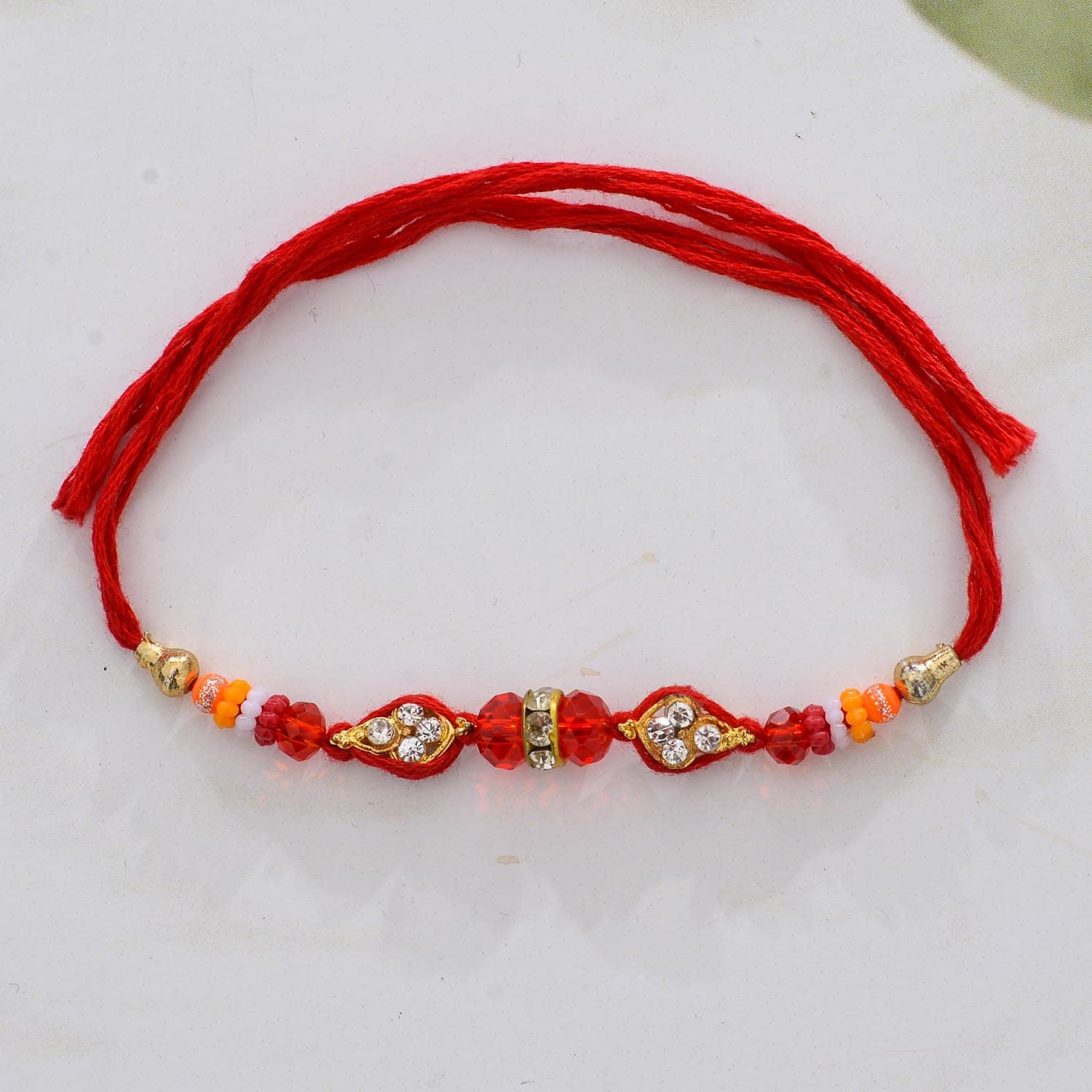Bright Red Pearl Rakhi  For Brother With Roli Chawal Set