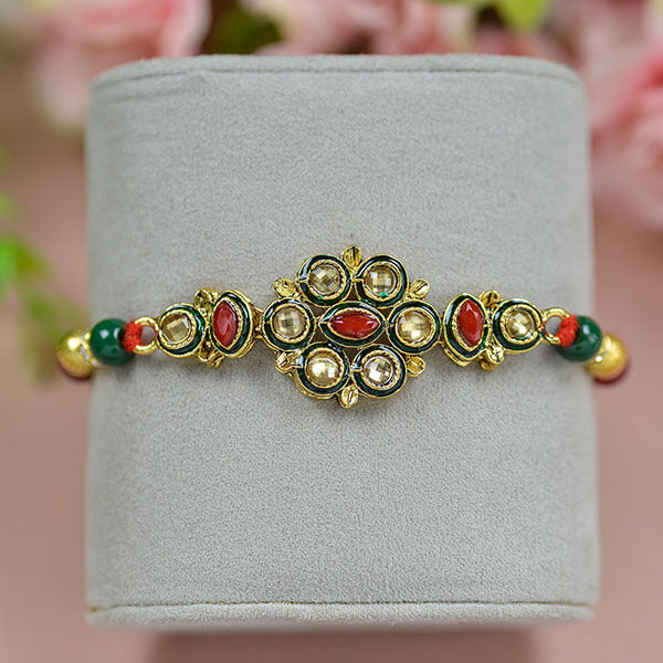 Exclusive Kundan Rakhi With Golden And Red Crystal Beads